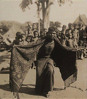 Lamaholot man dancing in ikated shawl